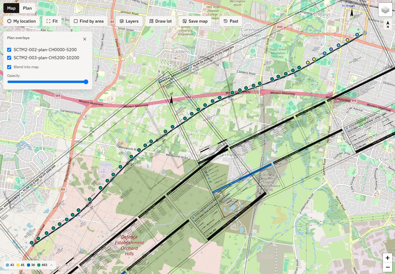 The same view with two issued plan sets registered to survey control and blended into the map, and the plan overlays panel open with an opacity slider
